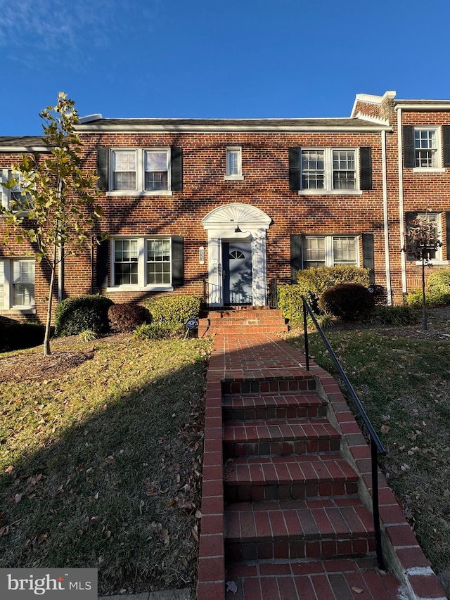 view of property with a front lawn