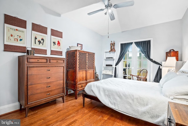 bedroom featuring hardwood / wood-style floors and ceiling fan