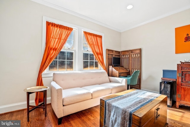 living room featuring hardwood / wood-style floors and ornamental molding