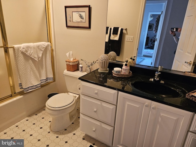 full bathroom with shower / bath combination with glass door, vanity, and toilet