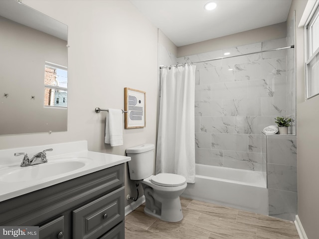 full bathroom featuring vanity, toilet, and shower / bath combo with shower curtain