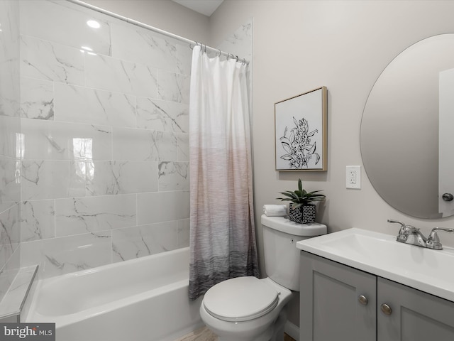 full bathroom with shower / tub combo, vanity, and toilet