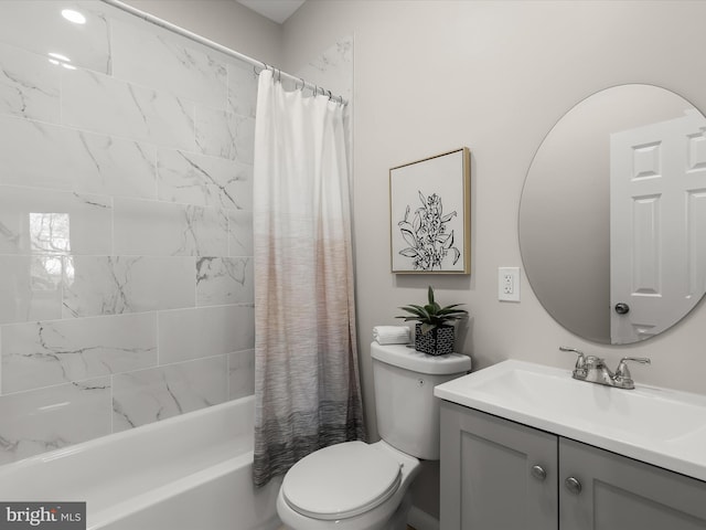 full bathroom featuring vanity, toilet, and shower / bath combo with shower curtain