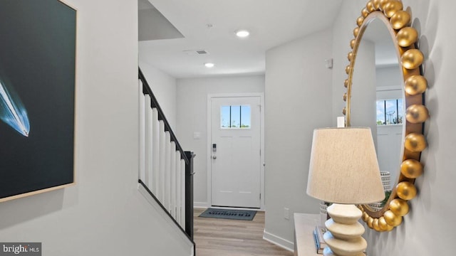 foyer entrance featuring light hardwood / wood-style floors and plenty of natural light