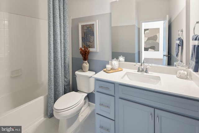 full bathroom with toilet, shower / bath combo, and vanity