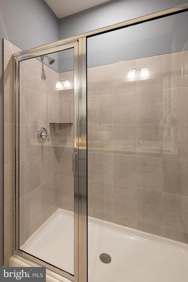 full bathroom with a shower stall