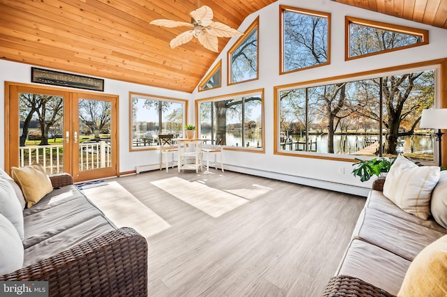 sunroom / solarium with a water view, vaulted ceiling, plenty of natural light, and wood ceiling