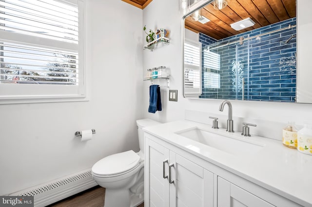 bathroom with a baseboard radiator, hardwood / wood-style floors, toilet, vanity, and wood ceiling