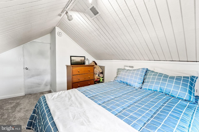 carpeted bedroom featuring vaulted ceiling