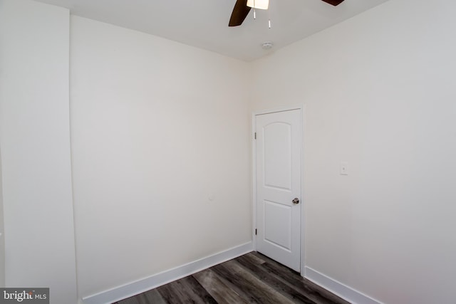 unfurnished room featuring dark hardwood / wood-style floors and ceiling fan