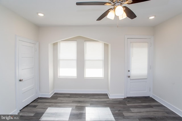 interior space featuring dark hardwood / wood-style floors and ceiling fan