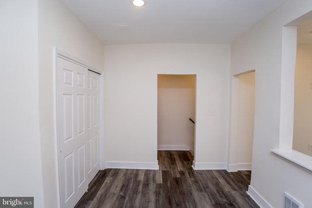 hall with dark hardwood / wood-style floors