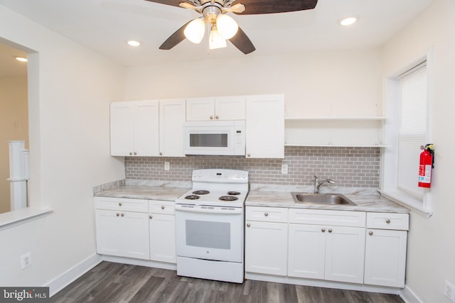 kitchen featuring white cabinetry, sink, dark hardwood / wood-style flooring, white appliances, and decorative backsplash