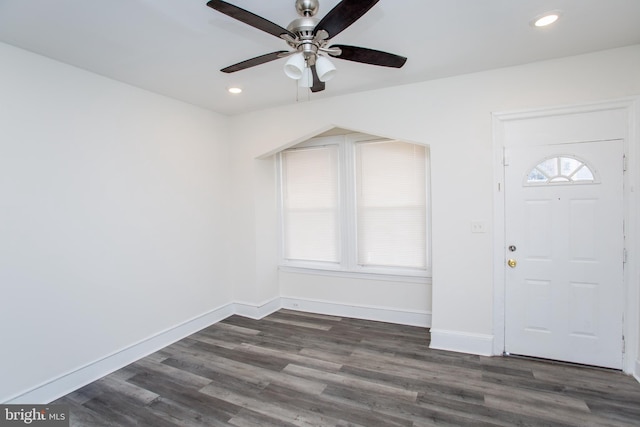 foyer with ceiling fan and dark hardwood / wood-style flooring