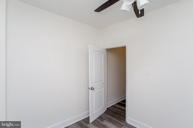 empty room featuring dark hardwood / wood-style floors and ceiling fan