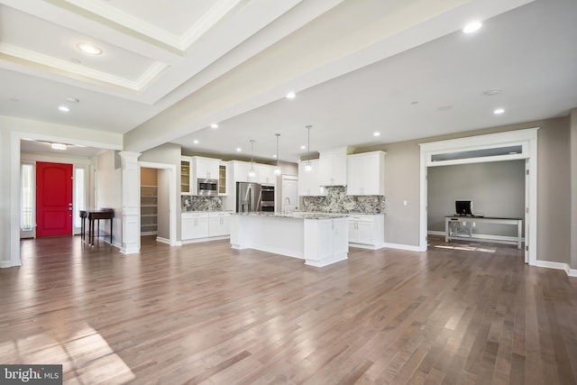 unfurnished living room featuring dark hardwood / wood-style floors and ornamental molding