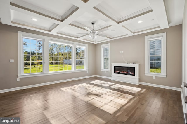 unfurnished living room featuring wood-type flooring, ceiling fan, coffered ceiling, and beam ceiling