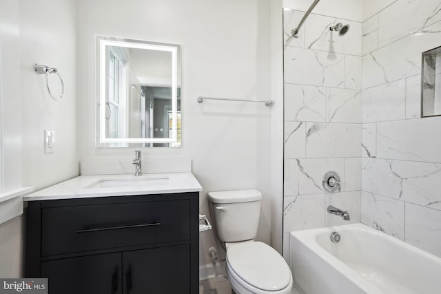 full bathroom featuring vanity, toilet, and tiled shower / bath