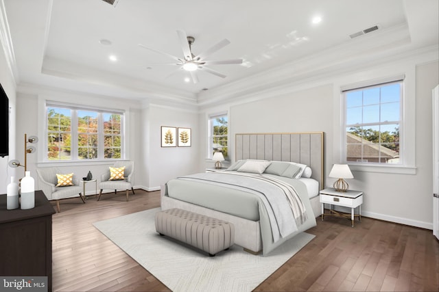 bedroom featuring multiple windows, ceiling fan, crown molding, and dark hardwood / wood-style floors