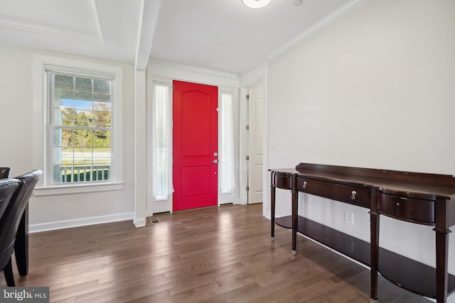 foyer with dark hardwood / wood-style flooring and crown molding