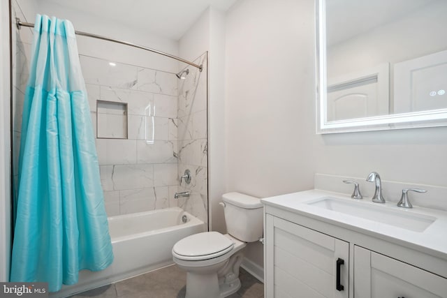 full bathroom featuring toilet, vanity, tile patterned floors, and shower / bath combo with shower curtain