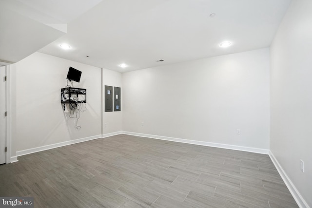 basement featuring light wood-type flooring