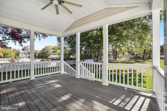 wooden deck featuring ceiling fan