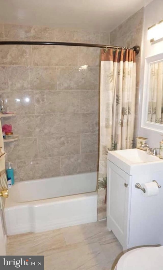 full bathroom with vanity, shower / bath combination with curtain, and toilet