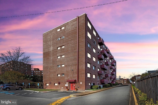 view of outdoor building at dusk