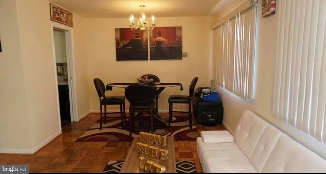 1830 Columbia Pike Unit 115, Arlington, VA 22204 - dining area featuring a chandelier and baseboards
