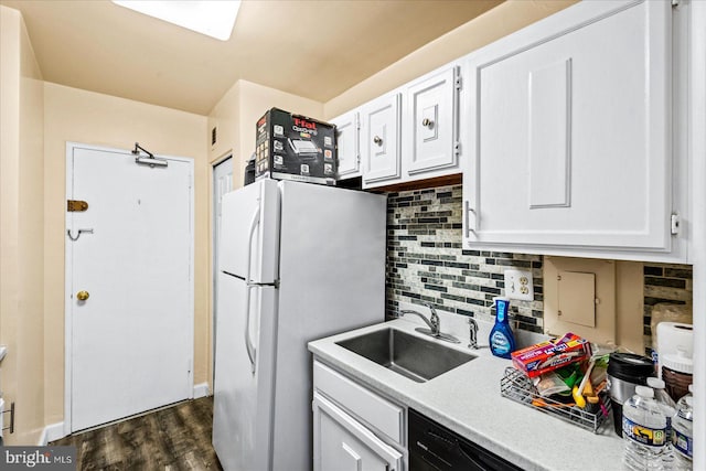 kitchen featuring tasteful backsplash, white cabinetry, sink, and dark hardwood / wood-style floors