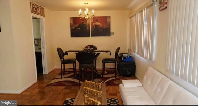 dining space featuring a chandelier