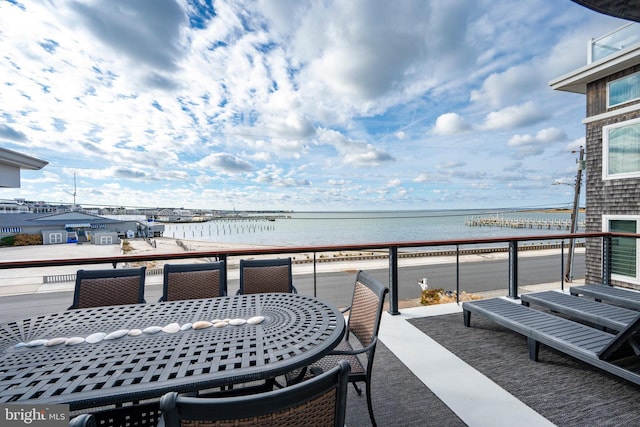 balcony featuring a water view