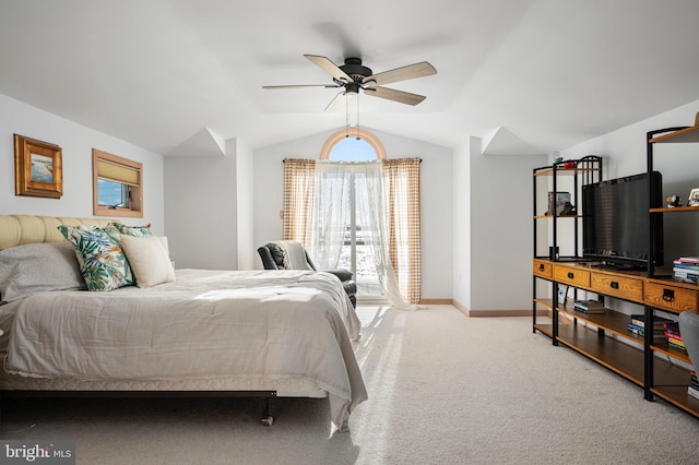 carpeted bedroom with ceiling fan and lofted ceiling