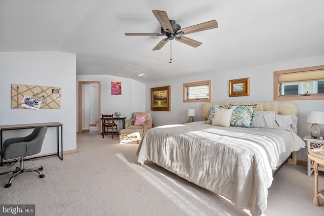 carpeted bedroom with ceiling fan and lofted ceiling