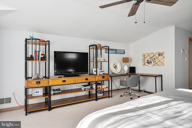 bedroom featuring ceiling fan, lofted ceiling, and light carpet