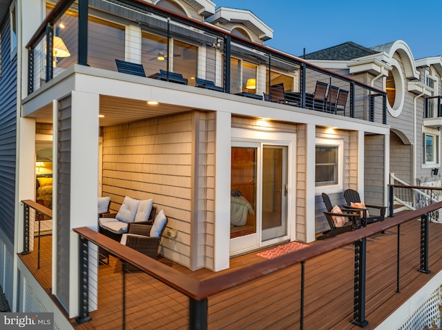 rear view of property with a balcony