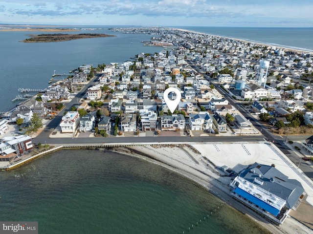 birds eye view of property featuring a water view and a view of the beach