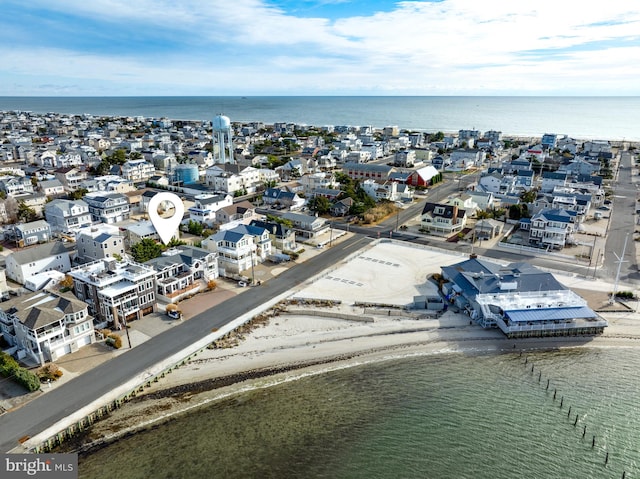 aerial view featuring a water view and a view of the beach