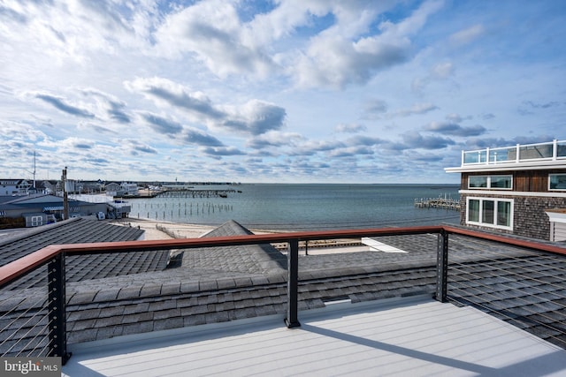 wooden terrace with a water view