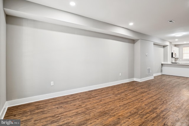 basement with dark wood-type flooring