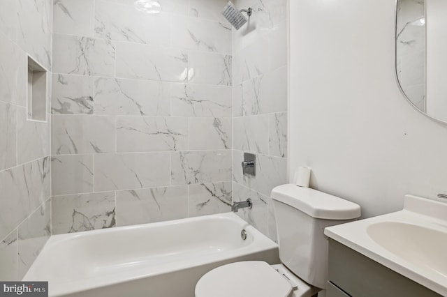 full bathroom featuring vanity, toilet, and tiled shower / bath combo