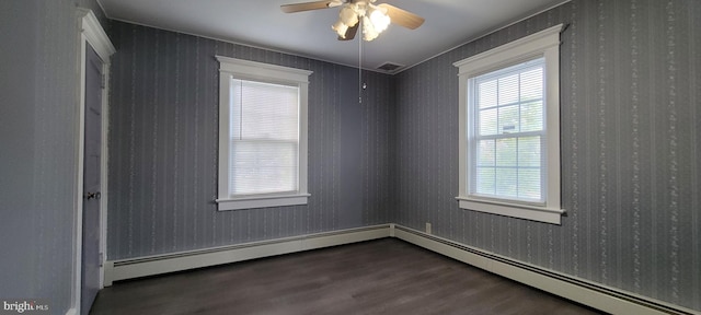 spare room with hardwood / wood-style floors, ceiling fan, and a baseboard radiator