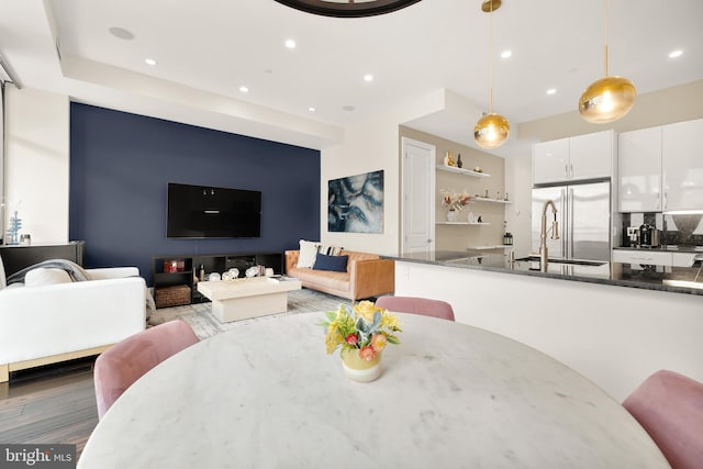 dining space featuring dark wood-type flooring and recessed lighting