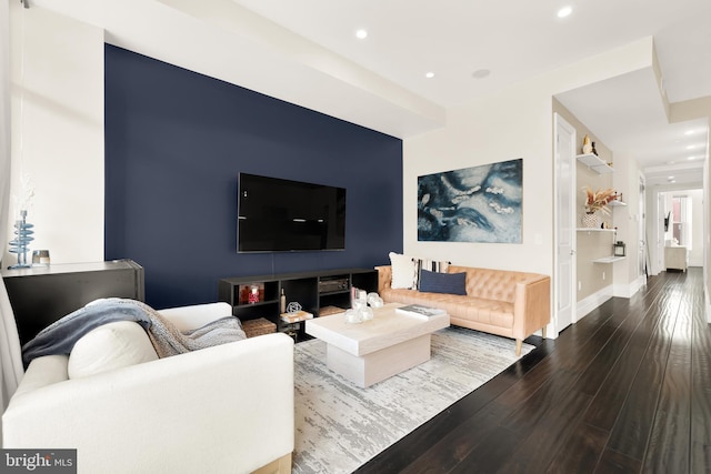 living area with recessed lighting, baseboards, and wood finished floors