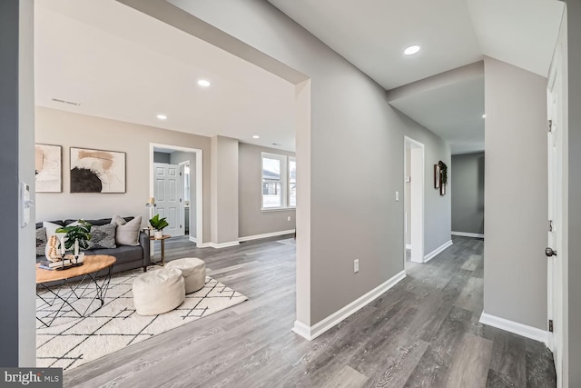 hall with baseboards, dark wood finished floors, and recessed lighting