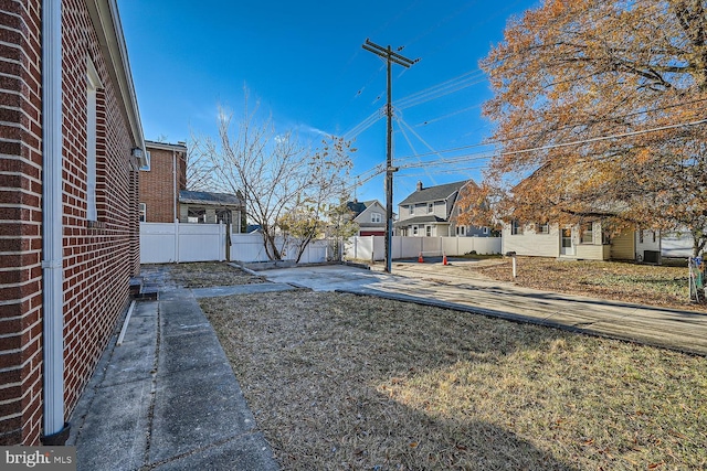 view of yard featuring a patio area and fence