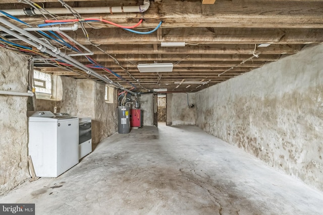 basement with washing machine and dryer and water heater