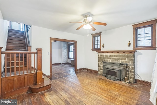 living room featuring hardwood / wood-style flooring and ceiling fan