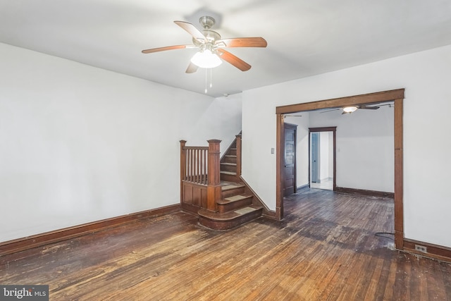 unfurnished room featuring dark hardwood / wood-style flooring and ceiling fan